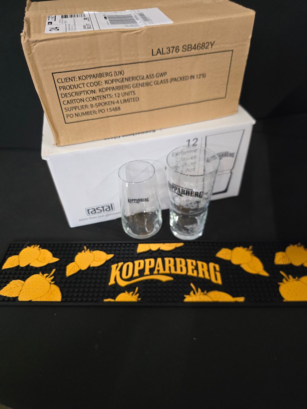 Lot 471: 24 Kopperberg glasses and bar mat. Brand new
