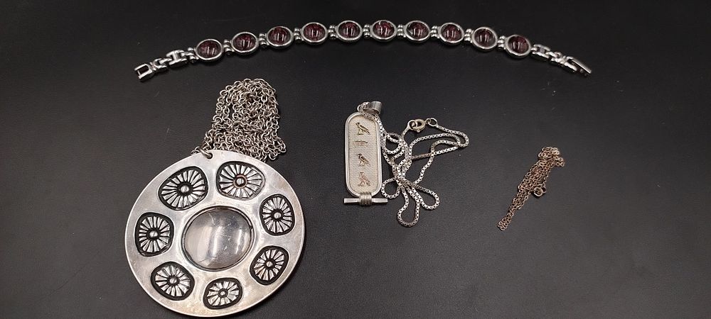 Lot 506: 2 x continental silver chains and pendants, one...