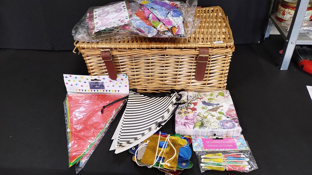 Lot 63: Wicker picnic basket, party bunting and other party...