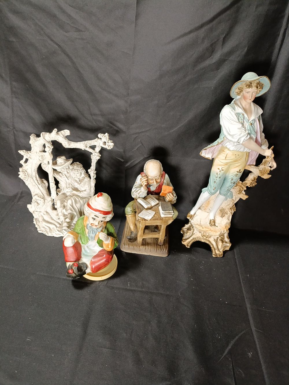 Lot 69: Collection of figurines including a musical rotating clown,...