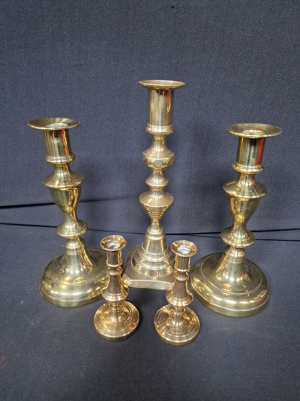Lot 115: 5 Brass Candlesticks. Approx 10, 19 & 23cm...