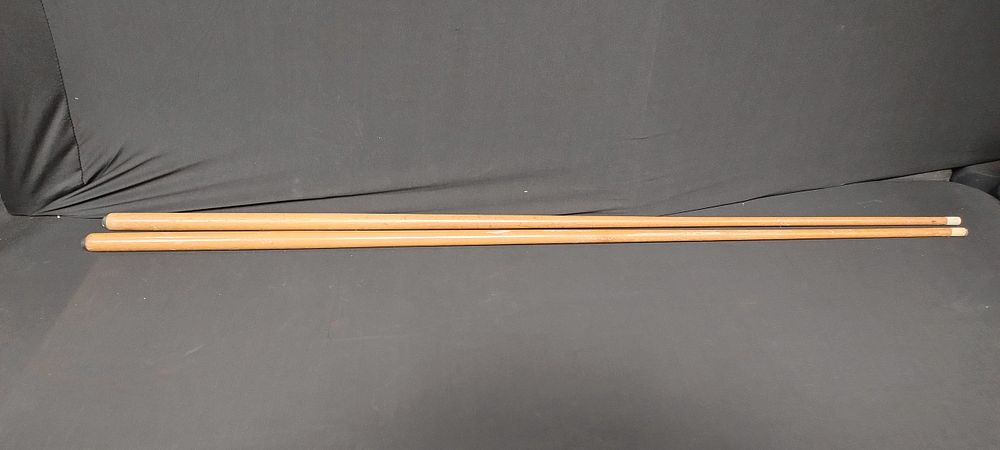 Lot 167: Two pool cues, one requires a tip