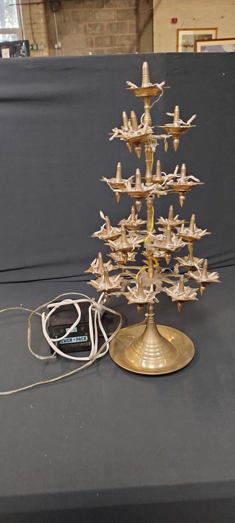 Lot 177: Heavy Hindi brass lamp decorated with lights with...