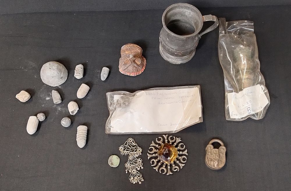 Lot 215: Selection of dig finds including lead fastening stud...