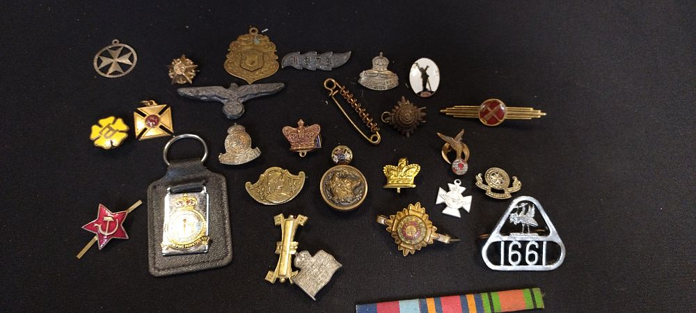 Lot 332: Selection of military cap pin  badges and other...
