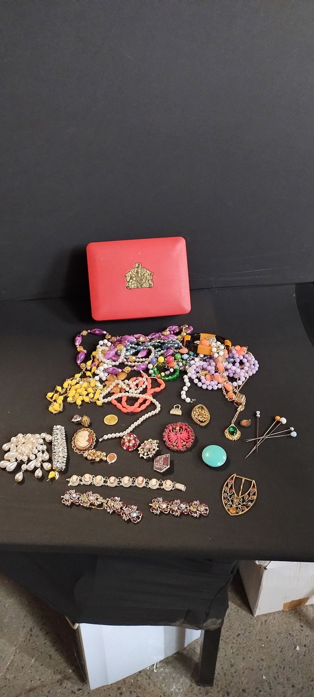 Lot 206: Vintage coffee tin containing costume jewellery including necklaces,...