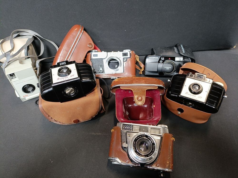 Lot 345: Selection of vintage cameras including Kodak, Olympus and...