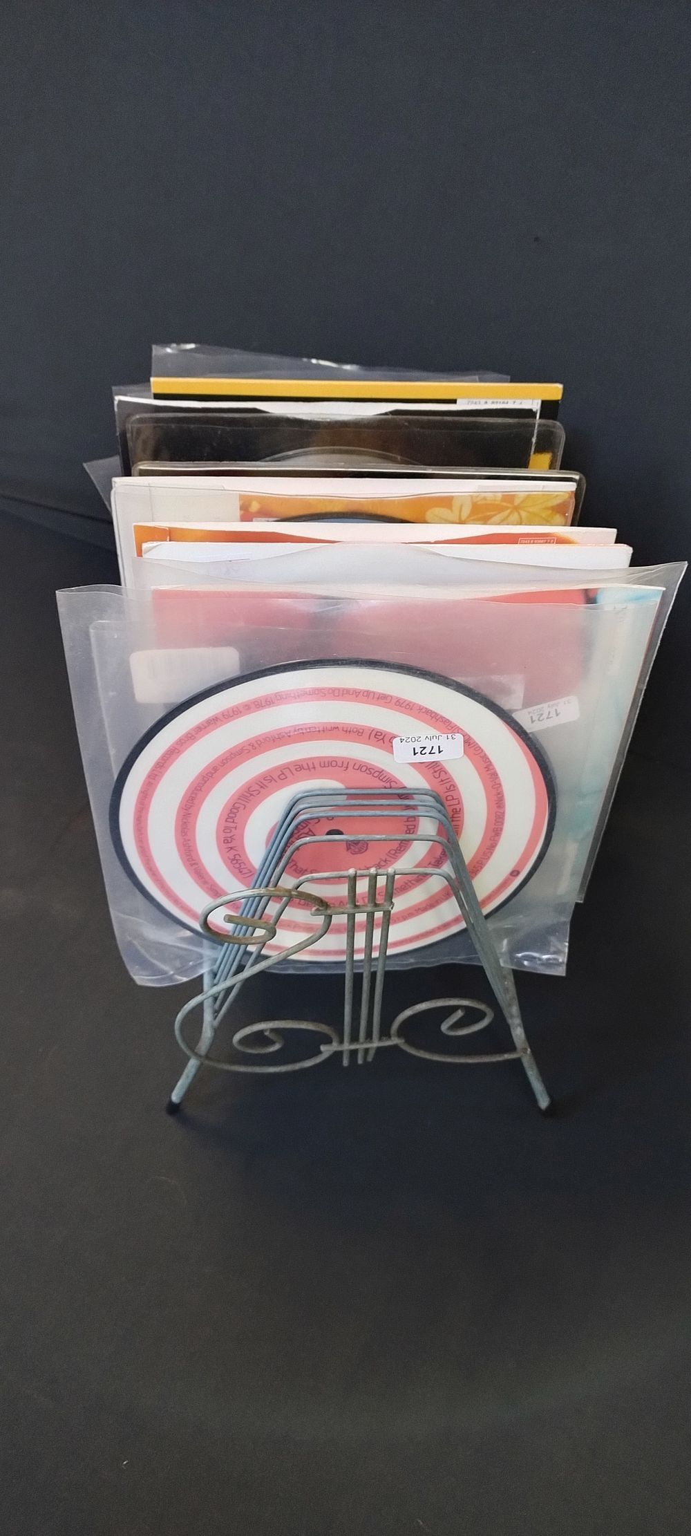 Lot 352: Selection of singles in a record stand various...