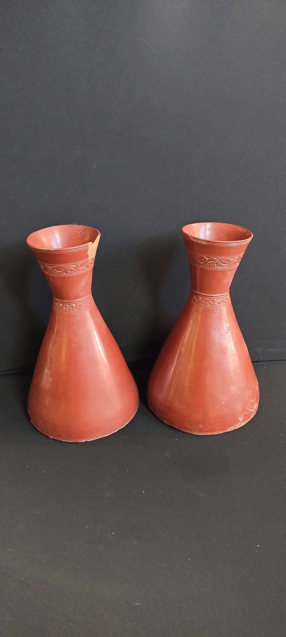 Lot 392: Two terracotta flute vases. Measures approx H 26...