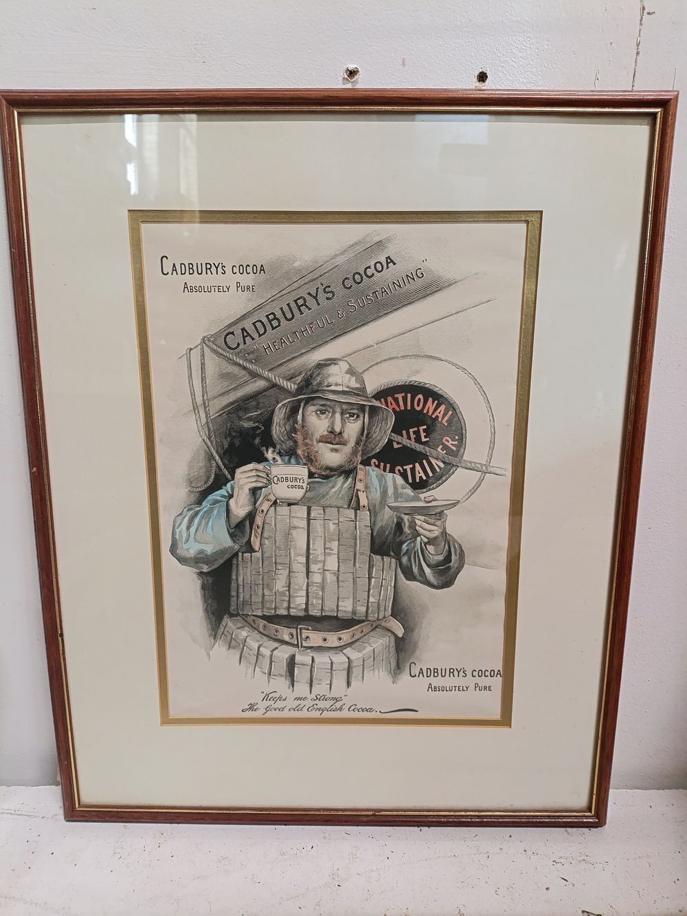 Lot 485: Print of a vintage Cadburys cocoa advertisement set...