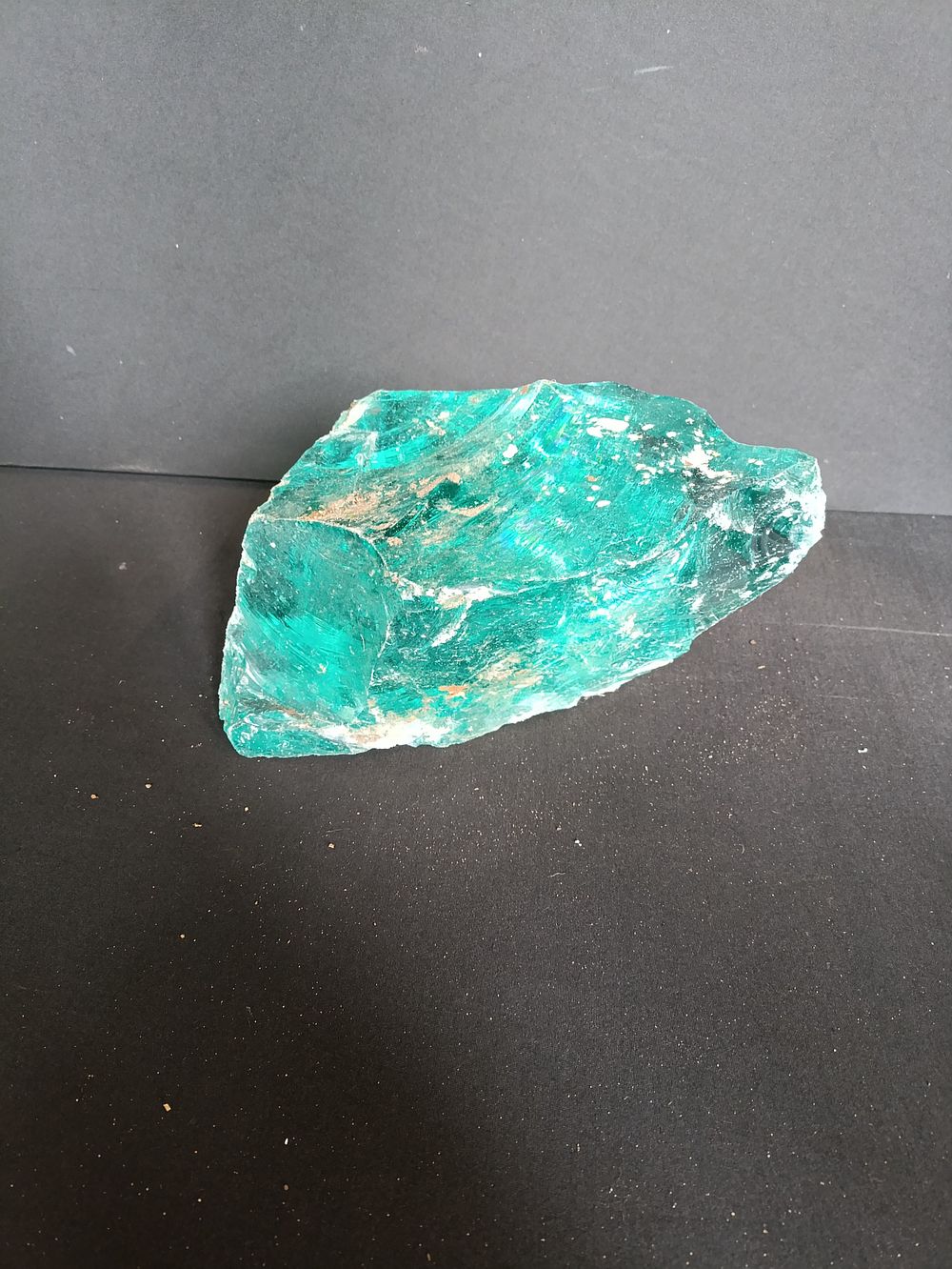 Lot 224: Large chunk of deep blue/green slag glass approximately...