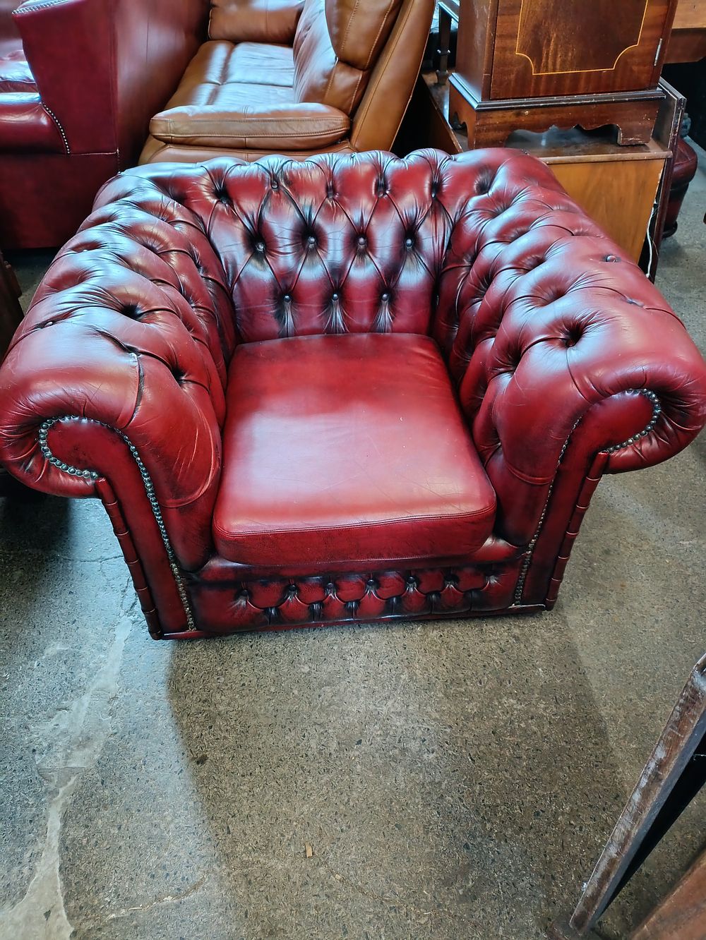 Lot 227: Vintage Chesterfield armchair with button detailing in oxblood...