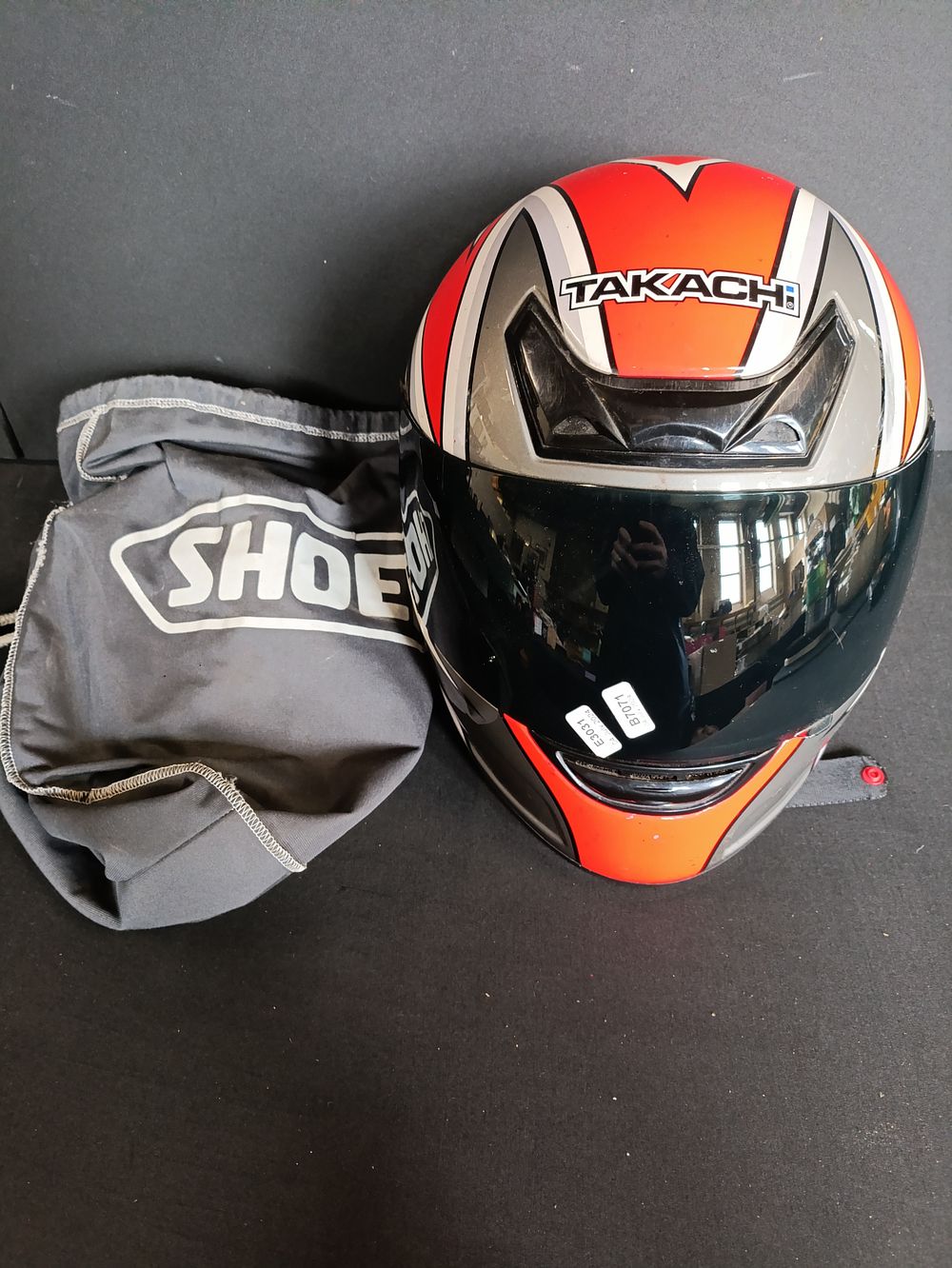 Lot 251: Takaghi red and black motorcycle helmet size M...