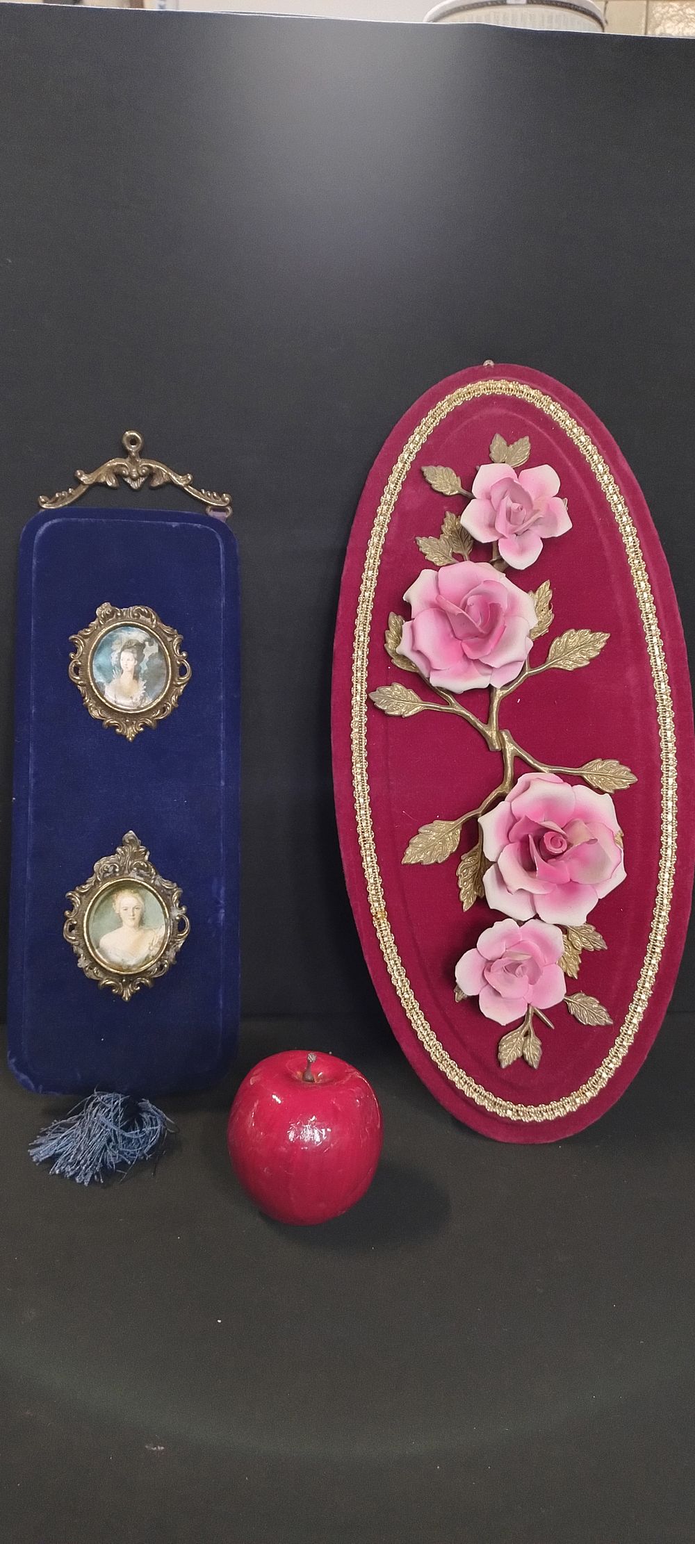 Lot 296: Two velvet wall hanging plaques one purple velvet...