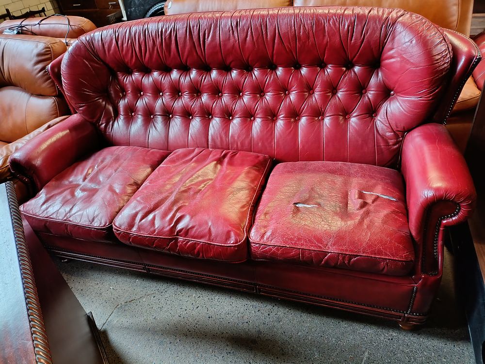 Lot 324: Vintage Chesterfield 3 seater sofa with button detailing...