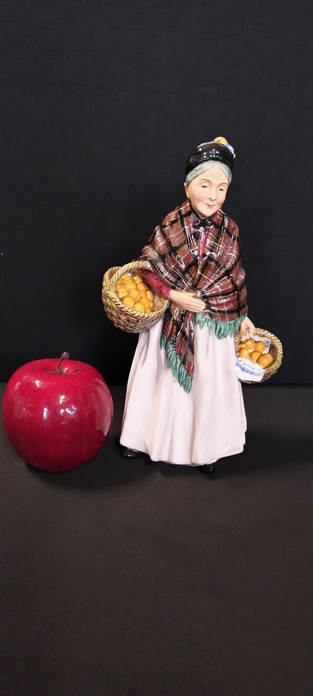 Lot 301: Royal Doulton The Orange Lady, H N 1759....