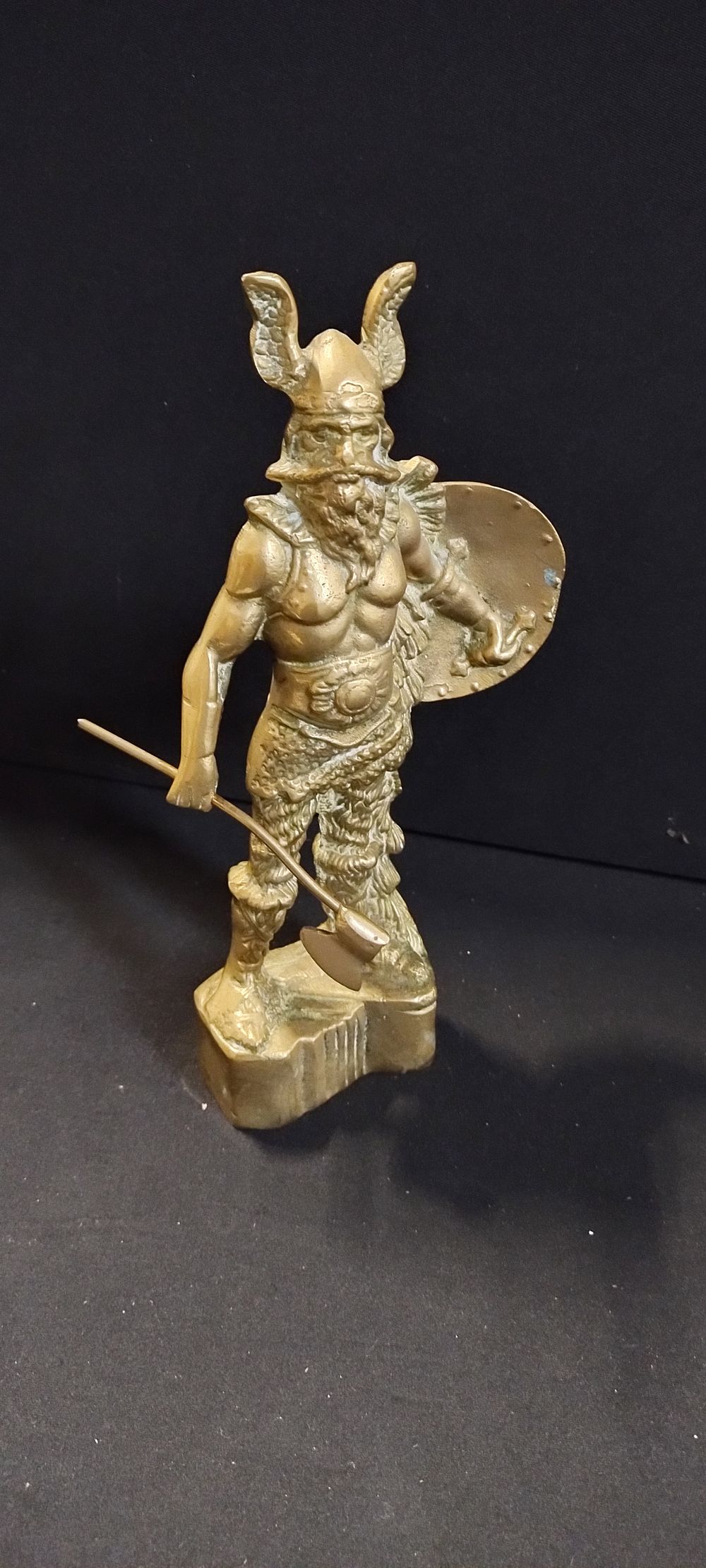 Lot 396: Solid brass viking warrior with a long handled...