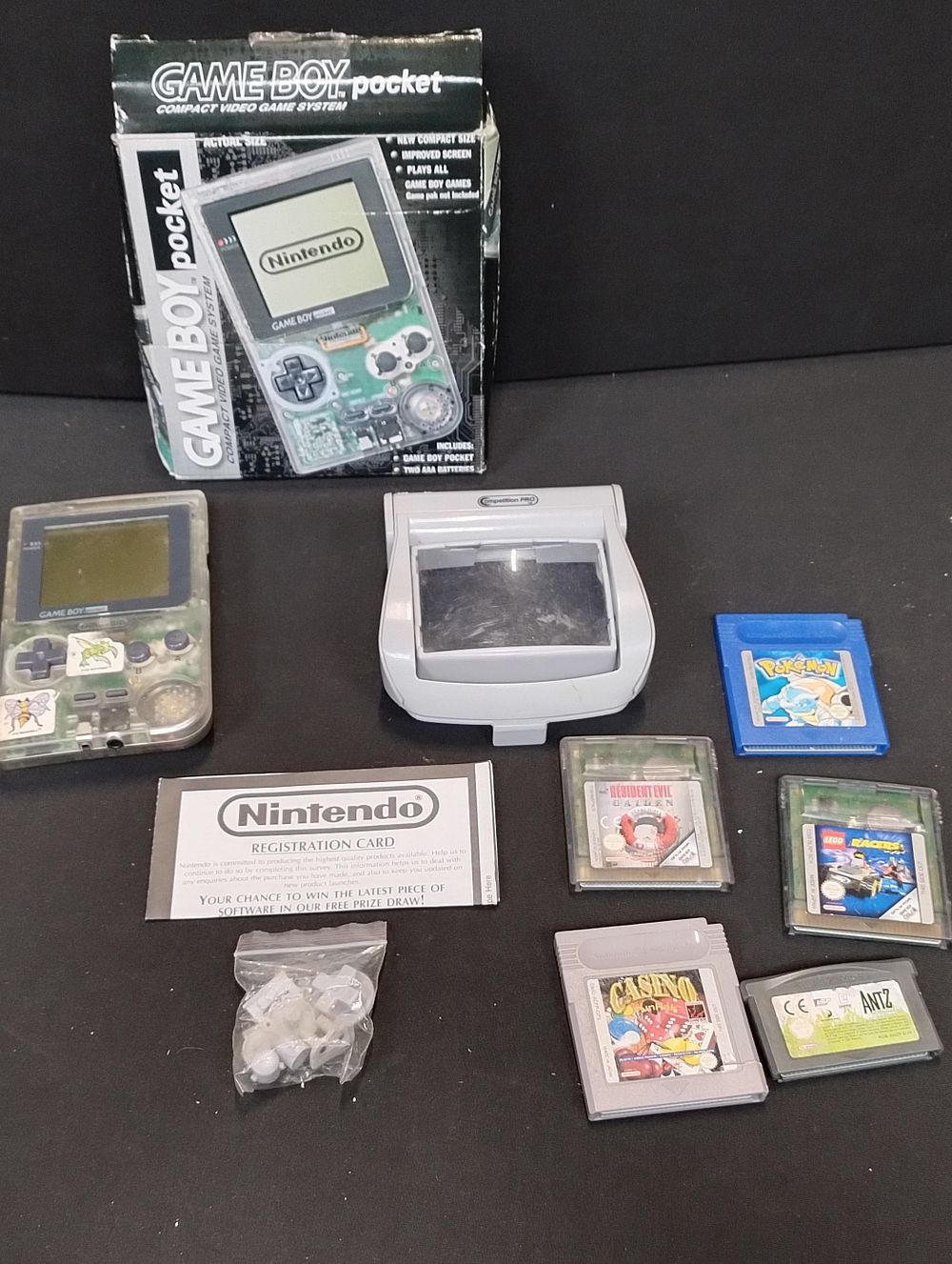 Lot 44: Vintage Boxed Gameboy Pocket Clear, with spare replacement...