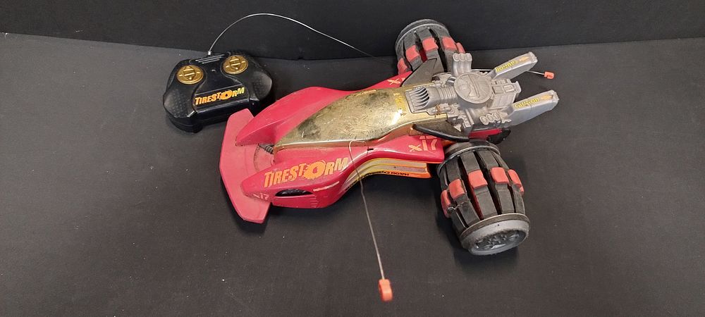 Lot 47: Tirestorm remote control car with controller