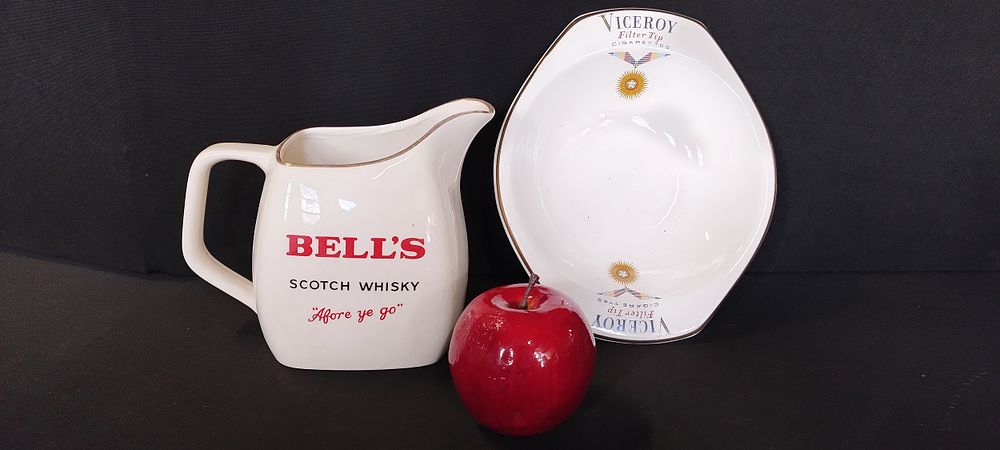 Lot 106: Bells Scotch whisky Water Jug by, and Viceroy...