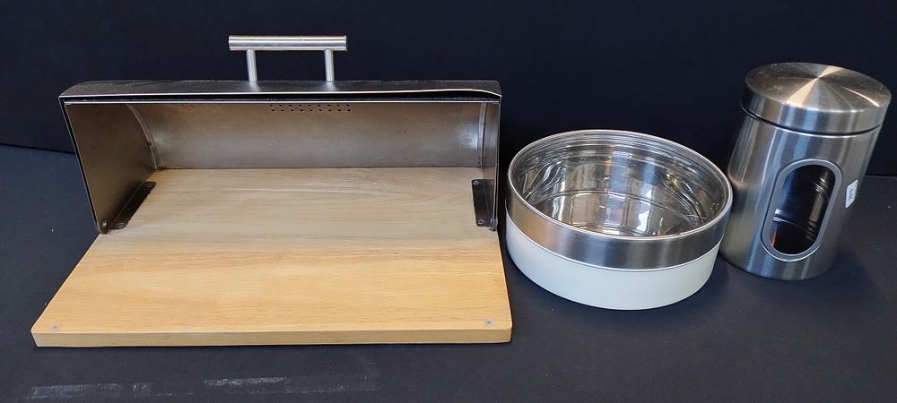 Lot 148: Zeller Stainless steel bread bin with wooden board...