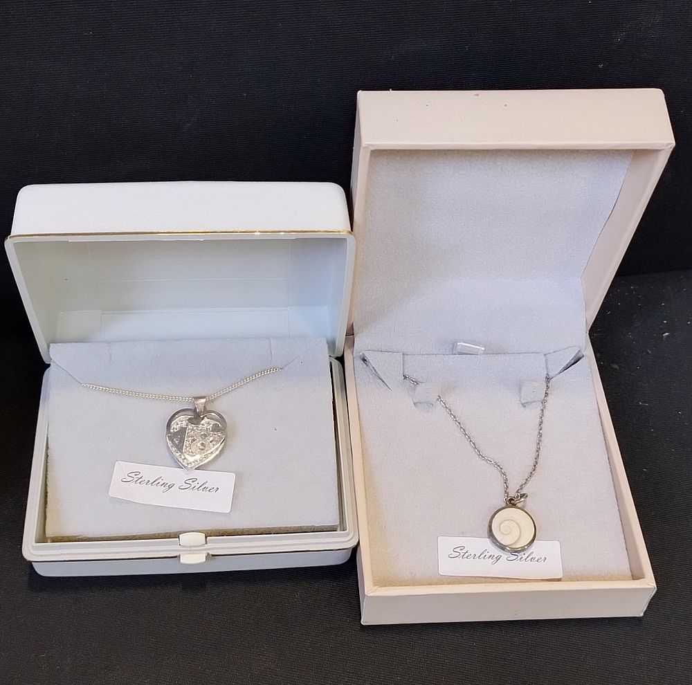 Lot 309: 4 x Sterling silver necklaces with pendants including...