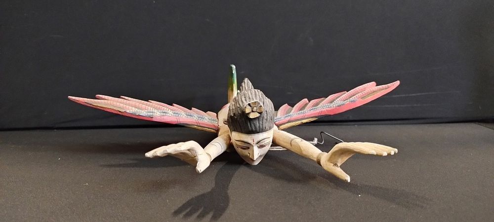 Lot 325: Indonesian flying goddess measures approx L 30 x...