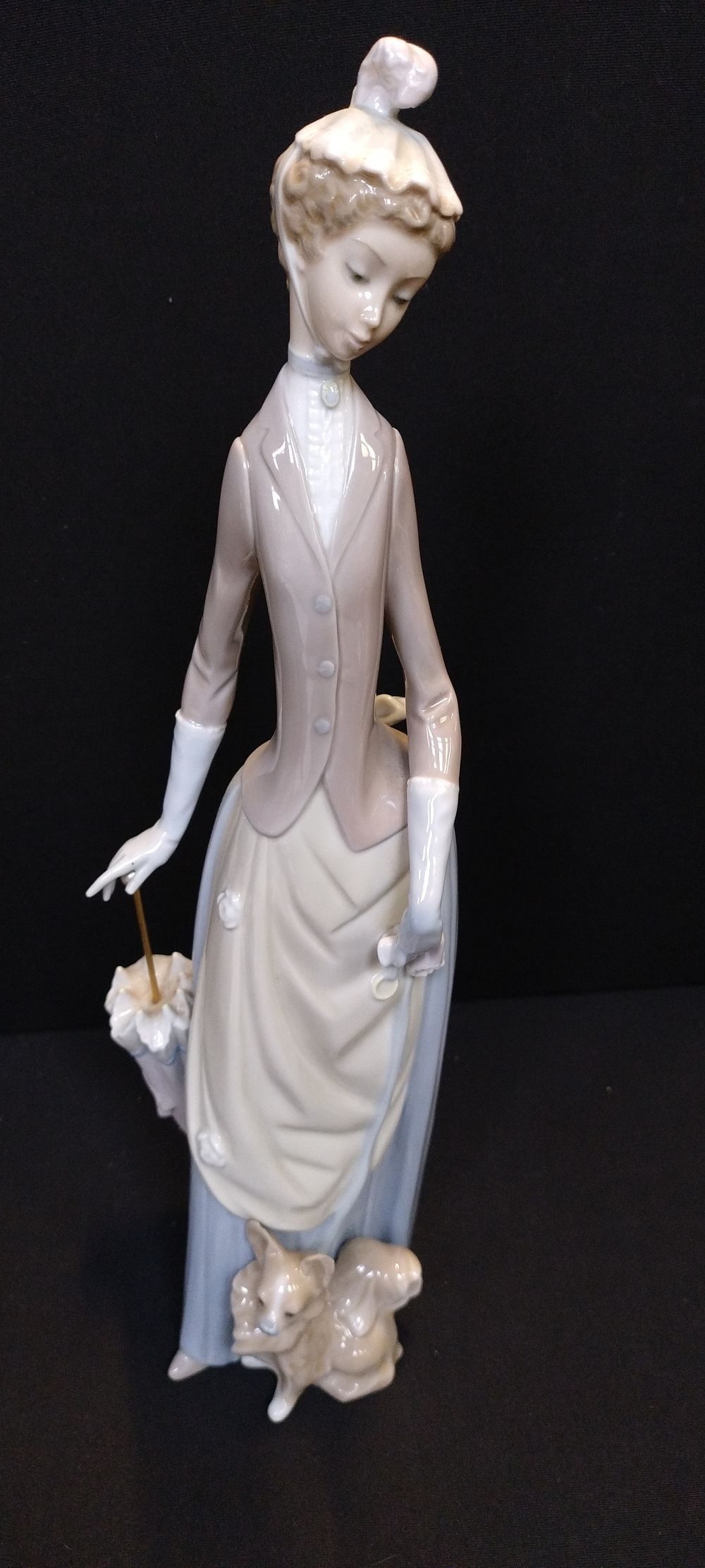 Lot 357: Large Lladro figurine of a lady with dog...