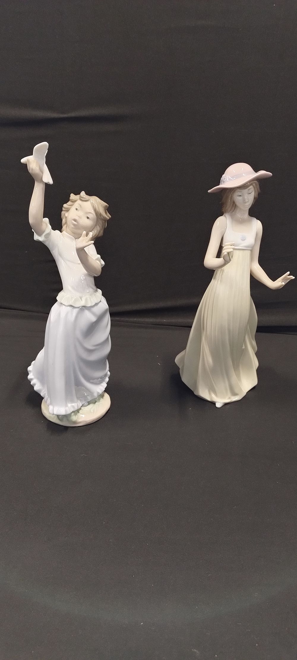 Lot 391: Two Nao figurines. Gentle Breeze, measures approx H...