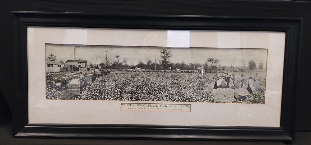 Lot 395: Large black and white image of cotton pickers,...