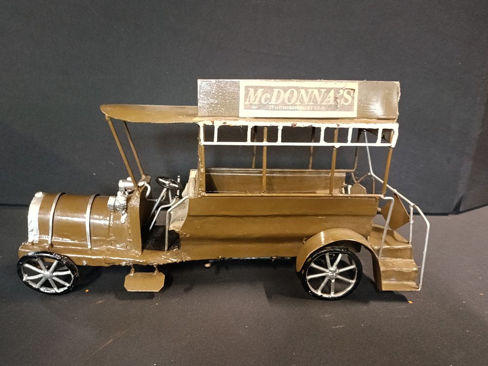 Lot 433: Large custom made cast metal vintage bus model,...