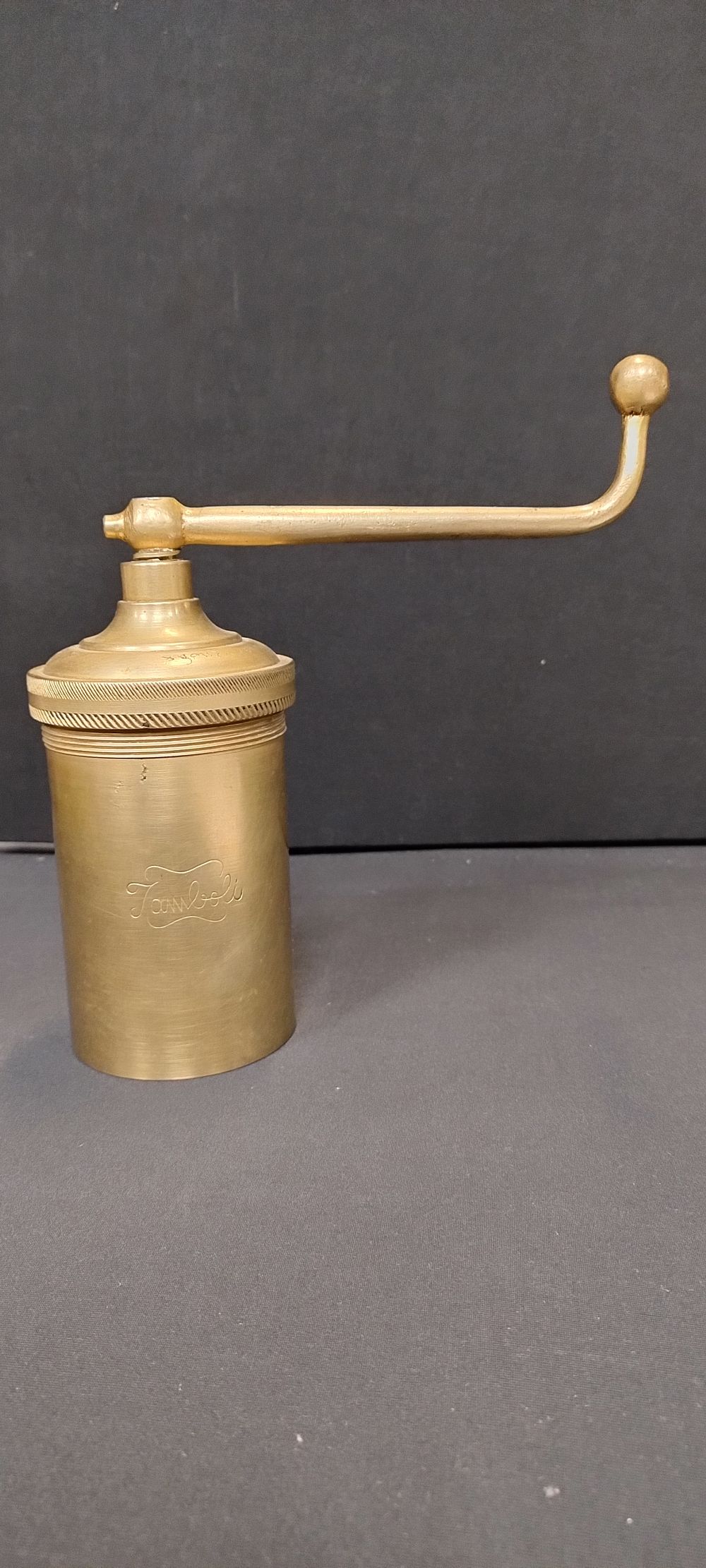 Lot 197: Brass jamboli food press with 4 changeable blades