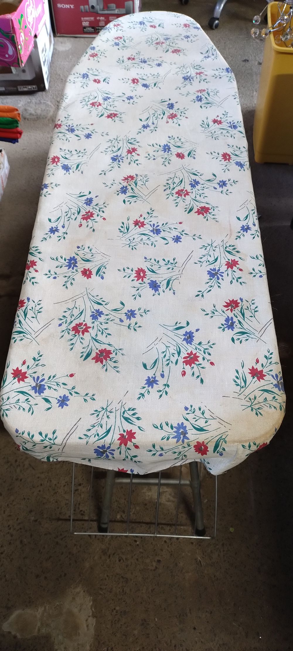 Lot 331: Fold up ironing board with 2 shelves