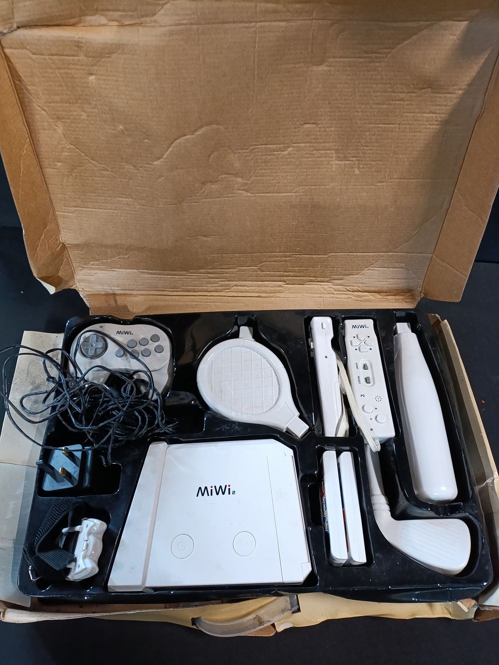 Lot 405: Miwi 2 Games Console with accessories in box,...