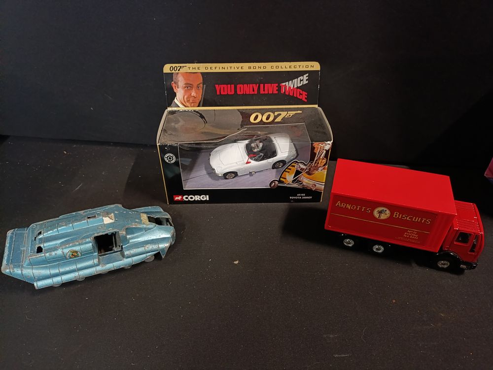 Lot 414: Three collectable diecast model vehicles including Corgi 2000GT...