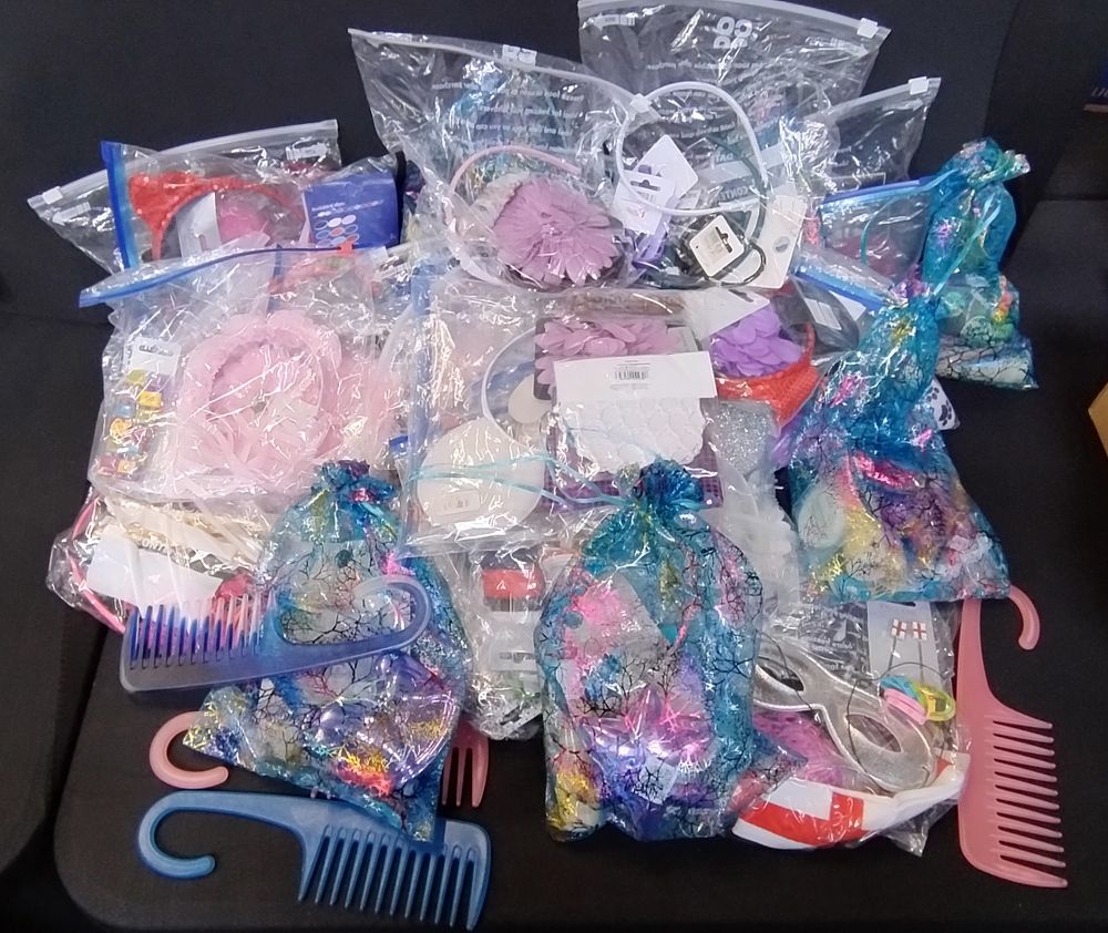 Lot 426: Mixed selection of ladies and girls hair and...