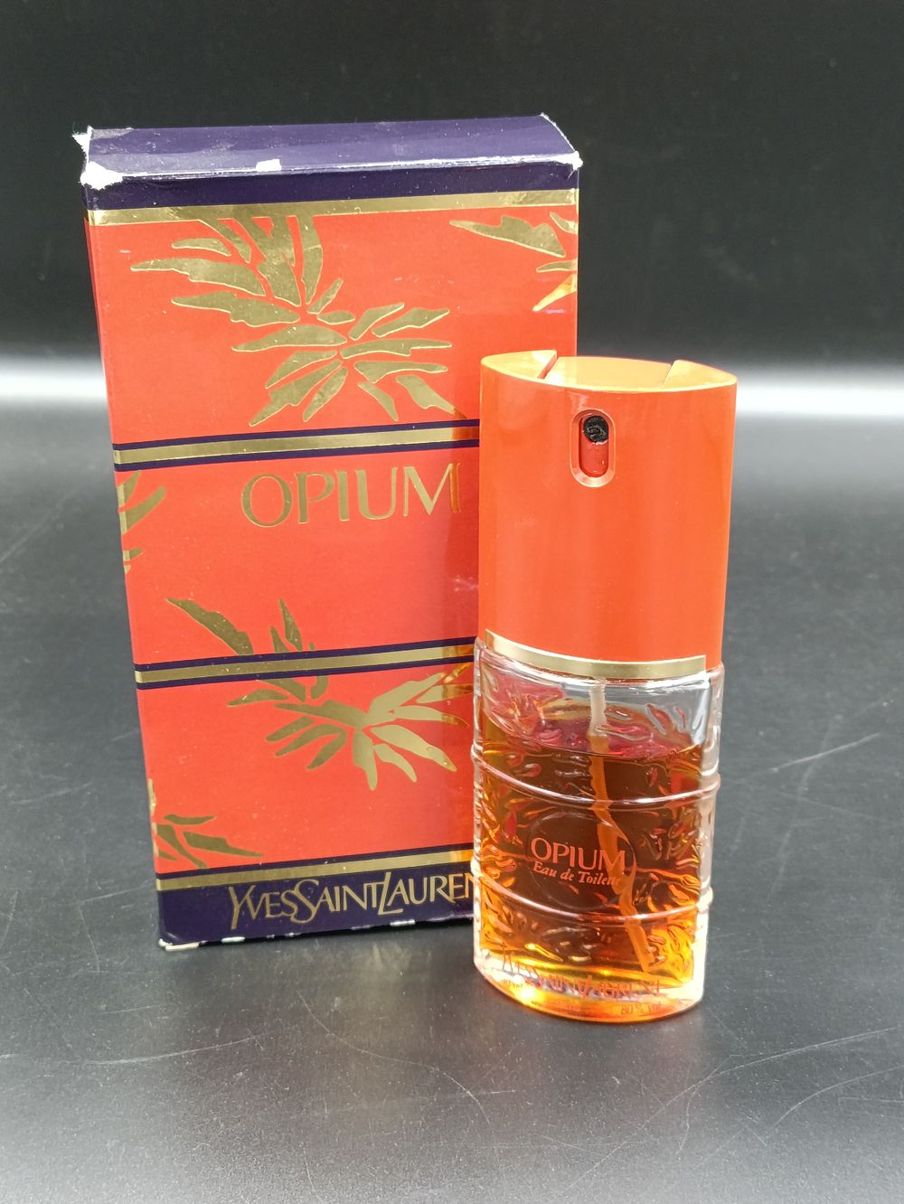 Lot 355: Nearly full bottle of Opium by Yves Saint...