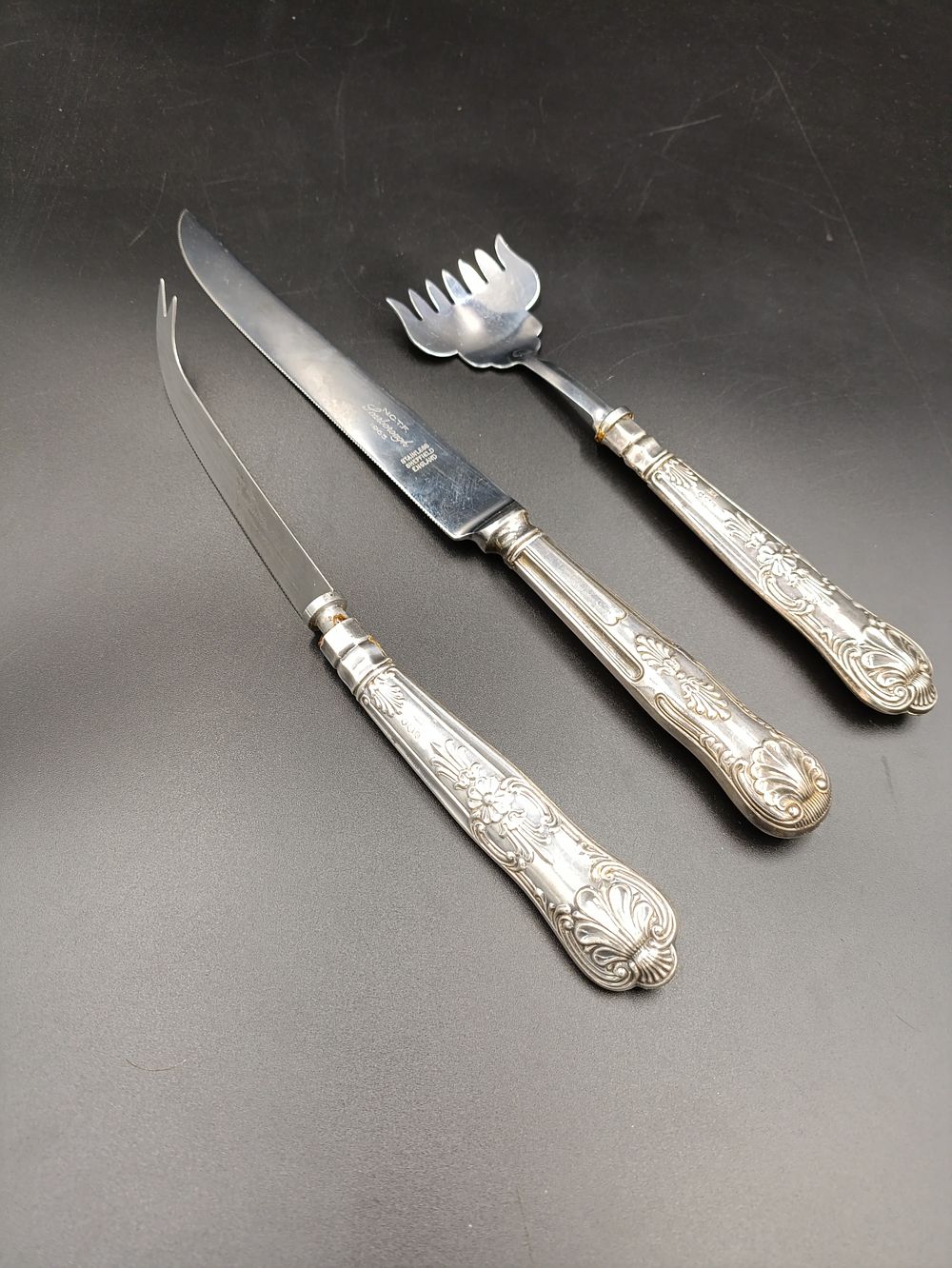 Lot 427: Ornate cutlery selection including two hallmarked handles made...
