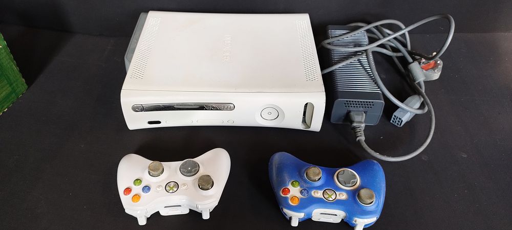 Lot 446: XBOX 360 games console and 2 official wireless...