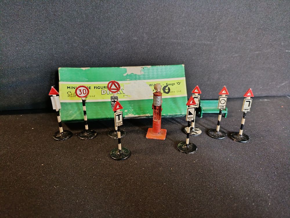 Lot 480: Vintage Dinky Miniature figures for railways including signs...