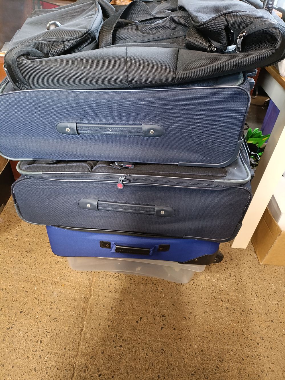 Lot 509: Three large suitcases and a large holdall