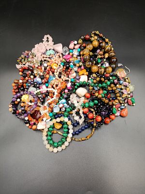 Selection of jewellery including coral, pearls, tigers eye and more