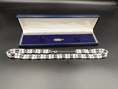 Vintage pearl necklace with sterling silver clasp along with another sterling silver clasp on 