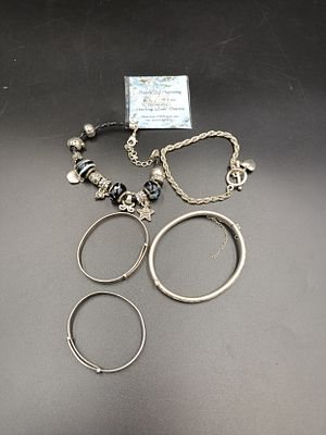 Selection of mostly sterling silver bracelets and charms