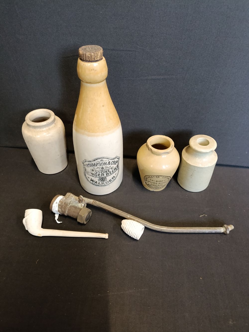 Lot 182: Selection of stoneware including jars, pipe and bottle