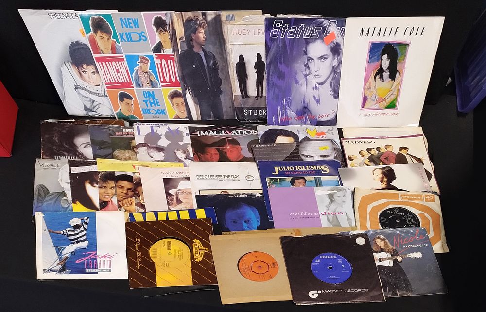 Lot 228: Red singles carry case containing various single vinyls,...