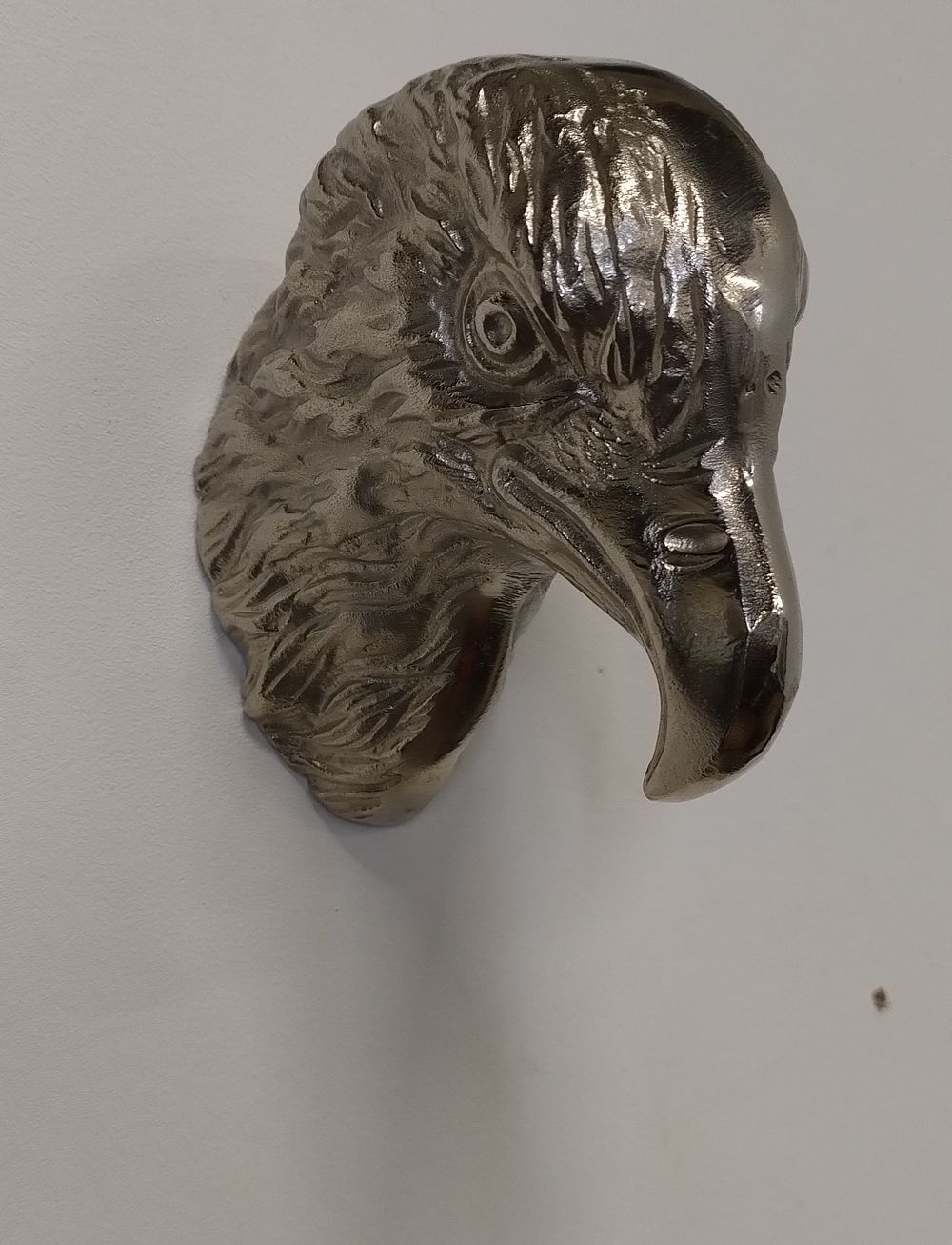 Lot 235: Chrome cast metal wall hanging eagle sculpture. Measures...