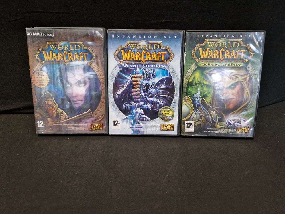 Lot 239: World of warcraft PC games x 3