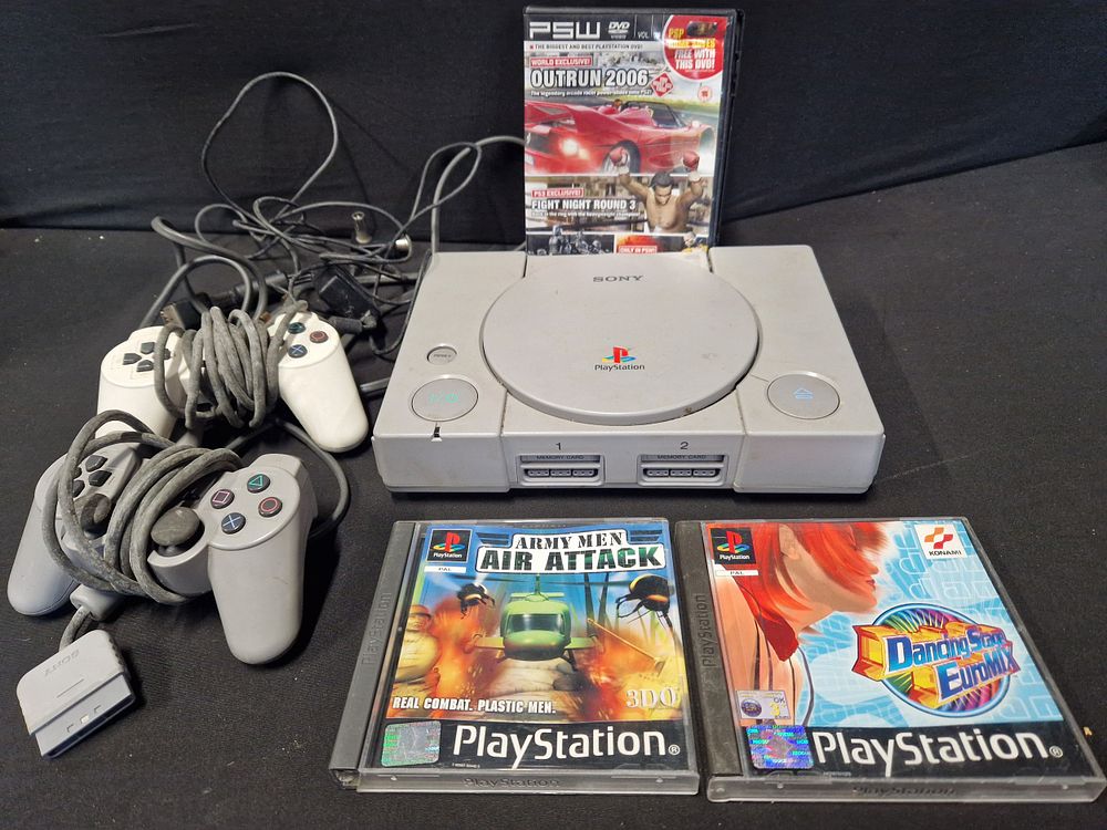 Lot 257: Sony Playstation one with two controllers and a...