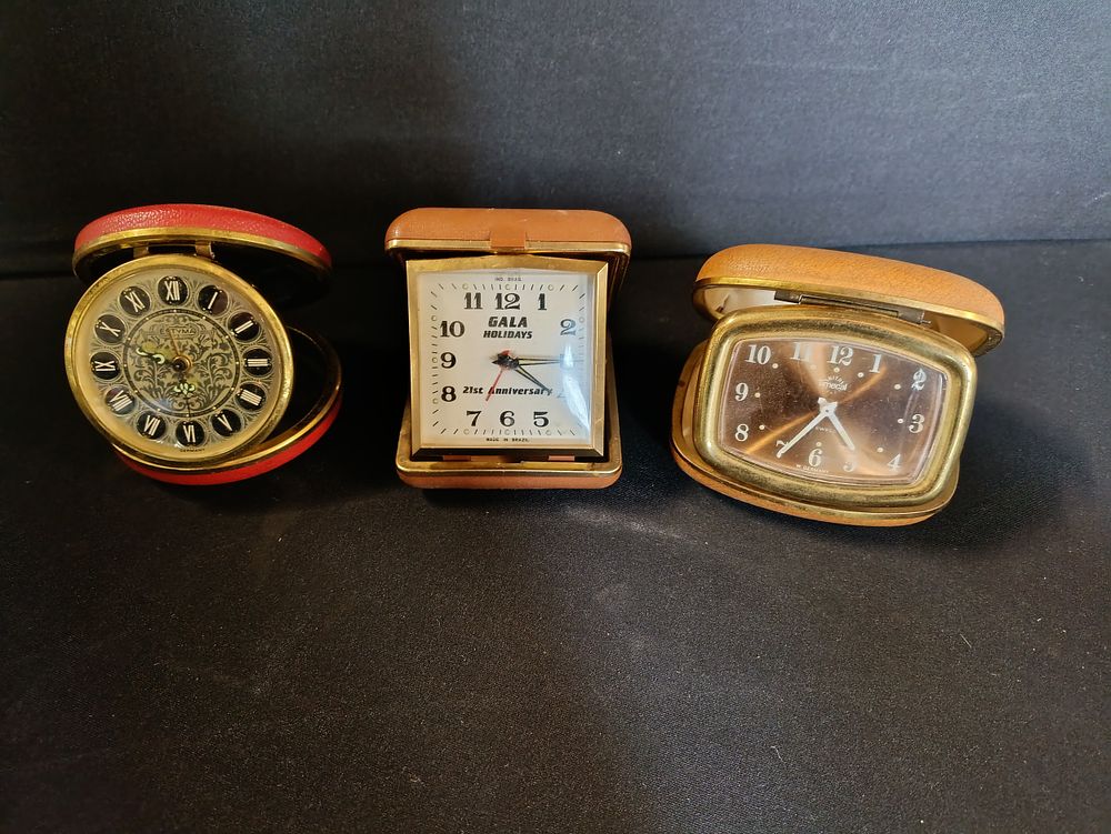 Lot 261: Three vintage travel alarm clocks including Estyma and...